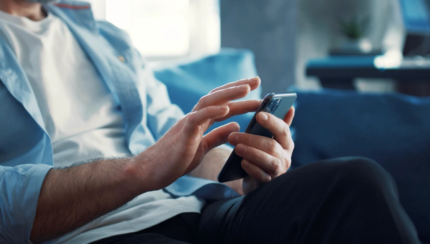 A business owner managing their business from a phone